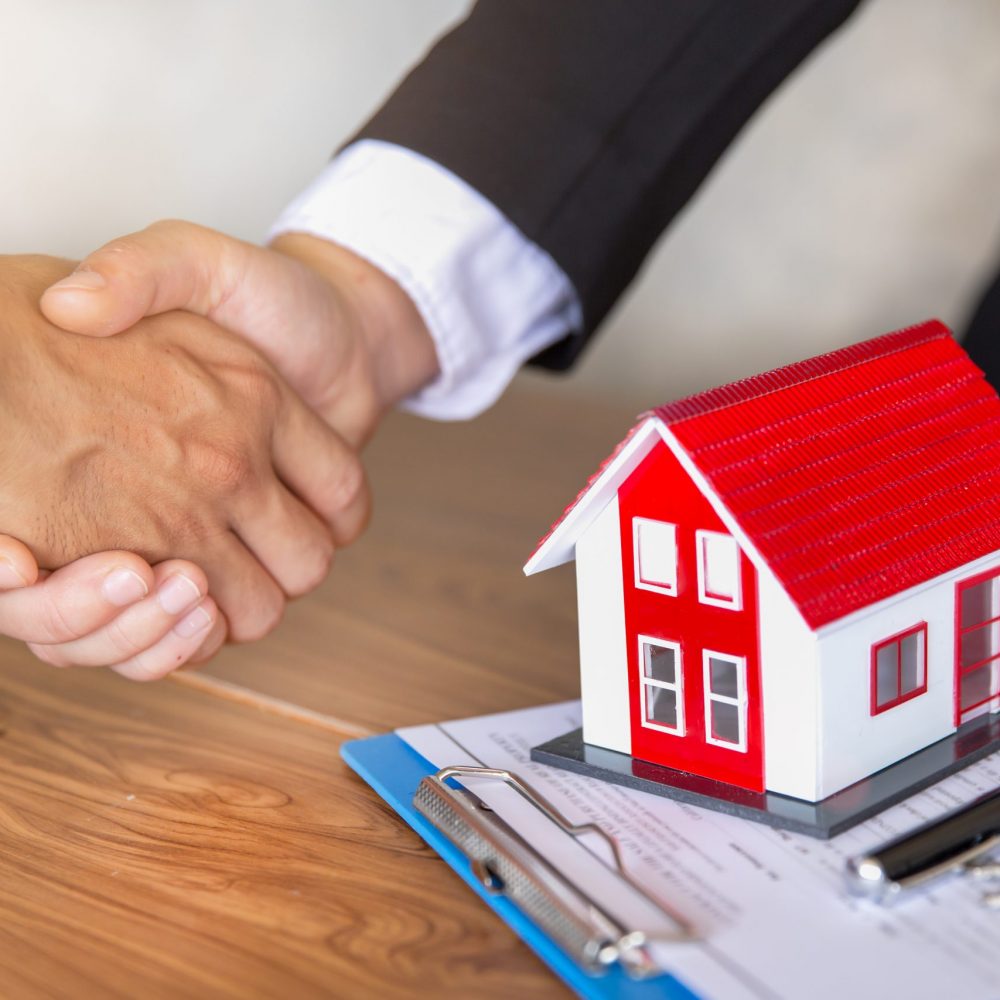Estate agent shaking hands with customer after contract signature, Business Signing a Contract Buy - sell house, Home for rent concept.